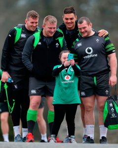 Ireland's Chris Farrell (left) alongside John Ryan, Quinn Roux and Jack McGrath pose for a photo with fan Jennifer Malone on arrival for the training session at Carton House, Co. Kildare. PRESS ASSOCIATION Photo. Picture date: Thursday February 22, 2018. See PA story RUGBYU Ireland. Photo credit should read: Brian Lawless/PA Wire. RESTRICTIONS: Editorial use only. No commercial or promotional use without prior consent from IRFU. No alterations or doctoring.